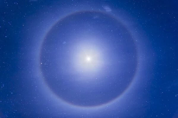 An ice crystal halo around the first quarter moon