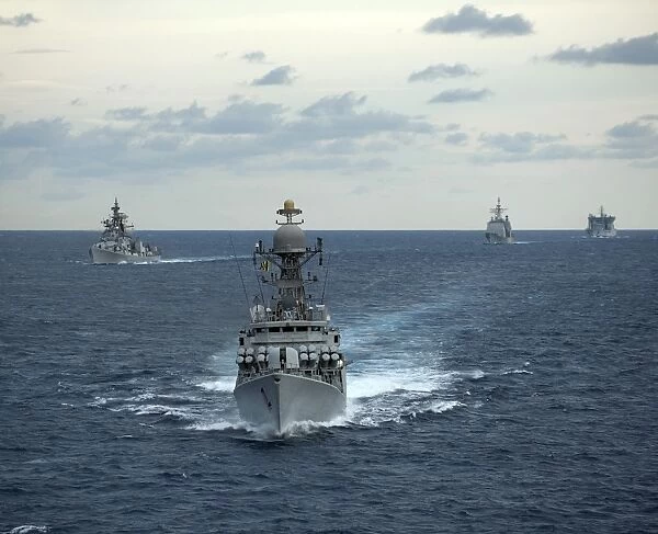 Indian Navy corvette ship INS Kulish leads a group of U. S. Navy ships