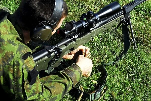 A Lithuanian special operations soldier engages targets with an assault rifle