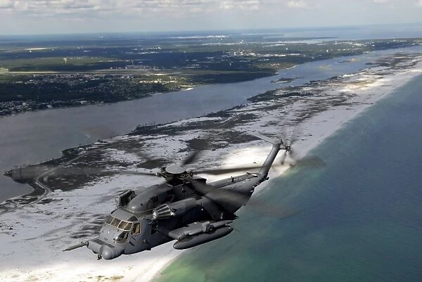 An MH-53 Pave Low flies over the coastline of Florida