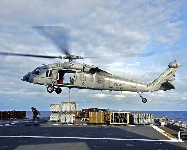 An MH-60S Seahawk prepares to deliver ammunition
