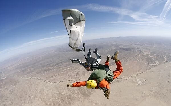 A military freefall parachutist deploys his parachute during a HALO jump