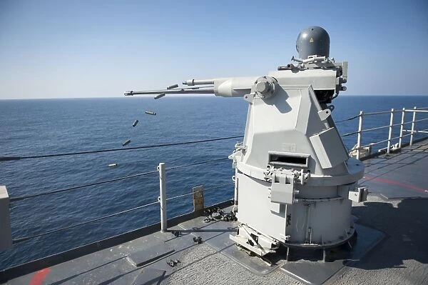 An Mk-38 machine gun system aboard USS Pearl Harbor