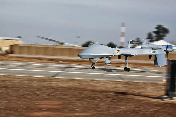 An MQ-1C Sky Warrior UAV lands at Camp Taji, Iraq