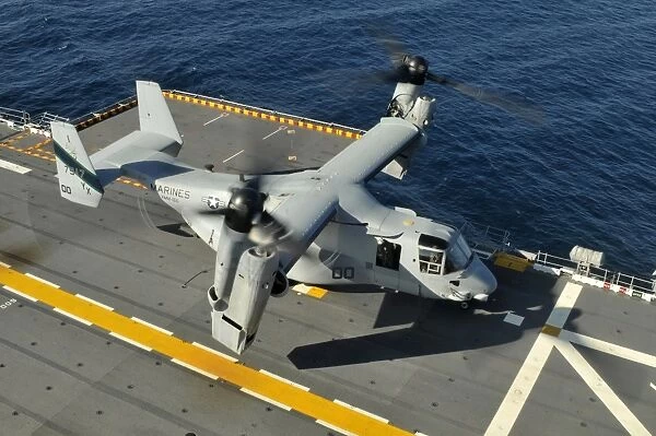 An MV-22 Osprey lands aboard USS Peleliu