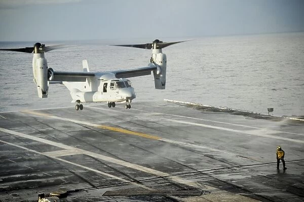 An MV-22 Osprey lands on the flight deck of USS George H. W. Bush