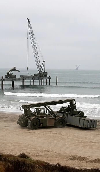 Navy Seabees dismantling an Elevated Causeway Modular