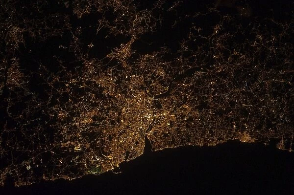 Nighttime image of Portugal showing city lights of Porto and Vila de Gaia
