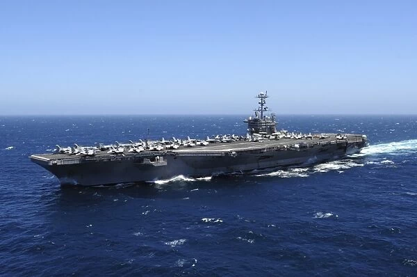 The Nimitz-class aircraft carrier USS John C. Stennis underway in the Pacific Ocean