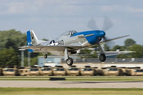 A P-51 Mustang takes off from Oshkosh, Wisconsin