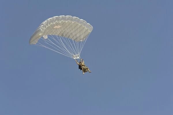 A pararecueman parachutes during a training mission