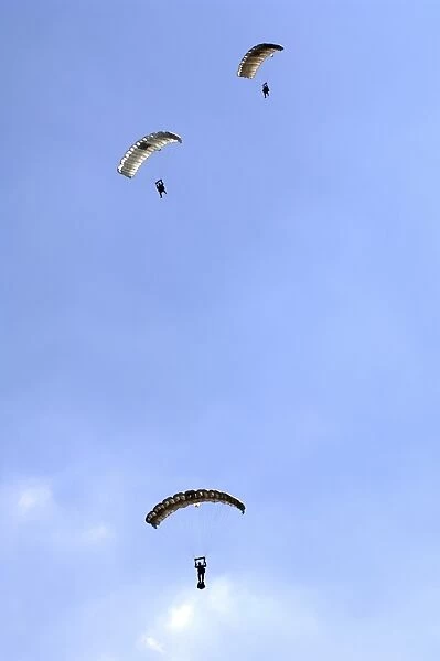 Paratroopers from the Pathfinder Platoon descend through the sky