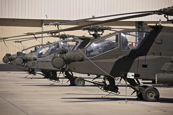 A row of AH-64D Apache Longbow helicopters