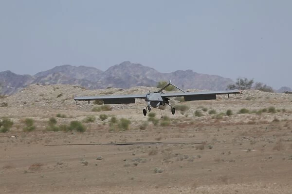 An RQ-7B Shadow unmanned aerial vehicle prepares to land