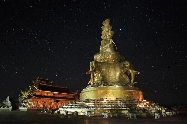 Samantabhadra statue on a dark starry night in Mount Emei, China