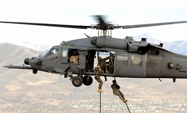 Soldiers are lifted on board an HH-60 Pave Hawk