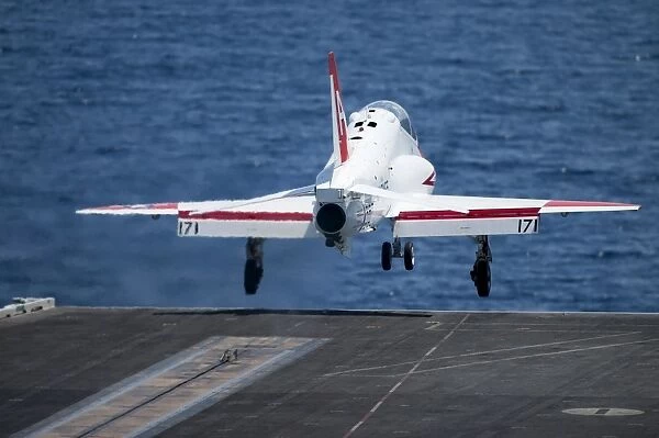 A T-45C Goshawk launches from the flight deck of USS Harry S. Truman