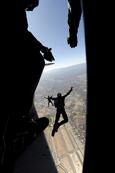 U. S. Air Force Academy Parachute Team jumps out of an aircraft over Nellis Air Force Base
