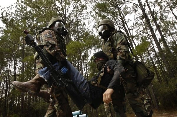 U. S. Air Force Airmen carry a simulated casualty to a secure location