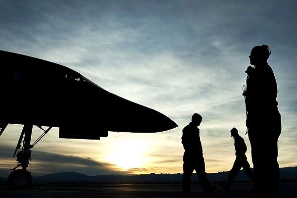 U. S. Air Force airmen prepare for a B-1B Lancer to launch