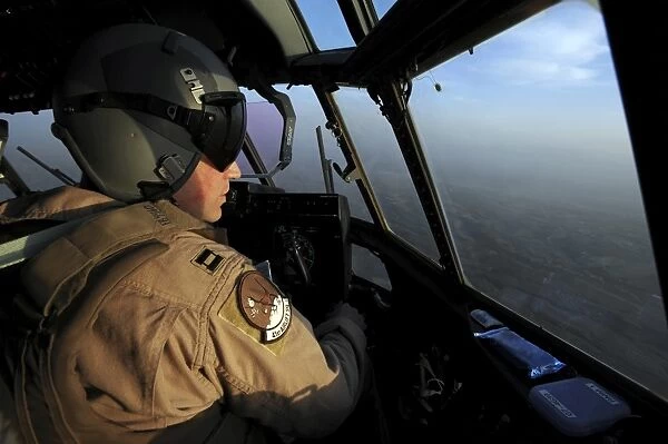 A U. S. Air Force C-130J Hercules pilot flies a mission over Afghanistan