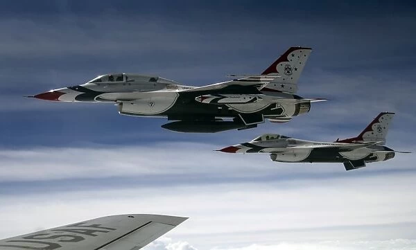 U. S. Air Force F-16 aircraft fly off the wing of a KC-135 Stratotanker