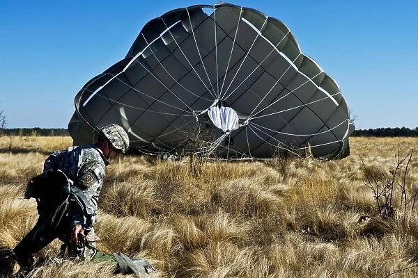 U. S. Army soldier lands after a static line airdrop