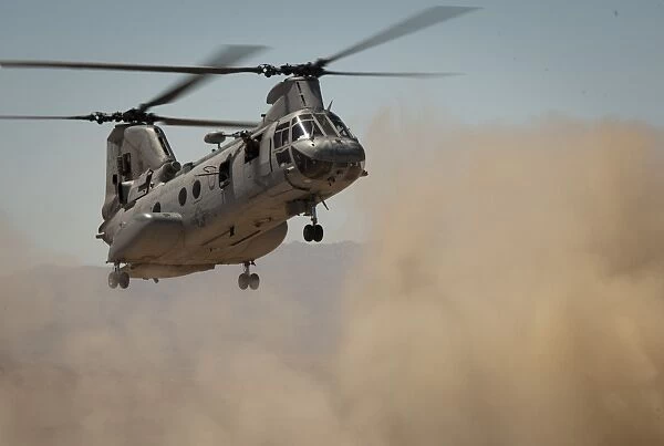 A U. S. Marine Corps CH-46E Sea Knight helicopter begins to land
