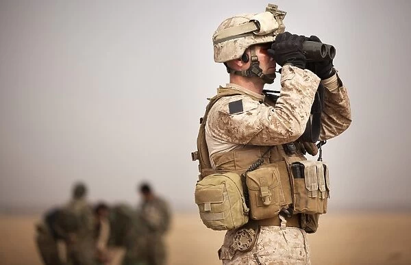 U. S. Marine determines target placement at a target range in Afghanistan