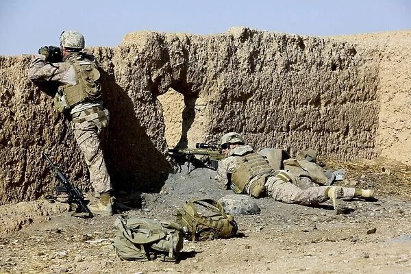 U. S. Marines take cover during a patrol in Afghanistan