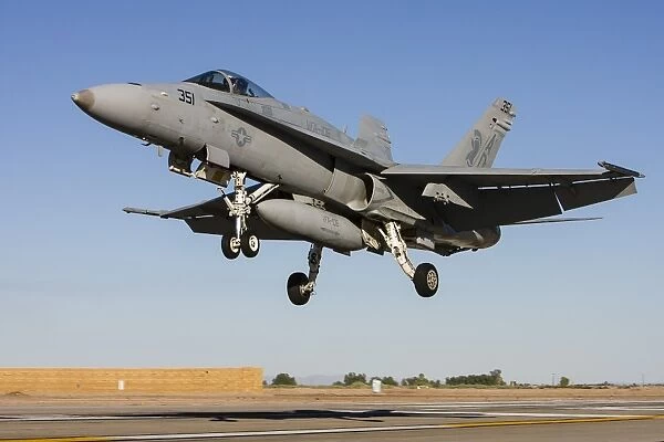 A U. S. Navy F  /  A-18C Hornet prepares for landing