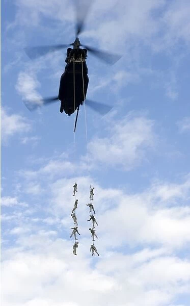 U. S. Soldiers are suspended by a CH-47 Chinook helicopter
