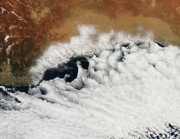 Unusual cloud formations crowd the coastline of Australia