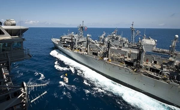 USS Nimitz, USNS Rainier, and USS Princton transit the Pacific Ocean