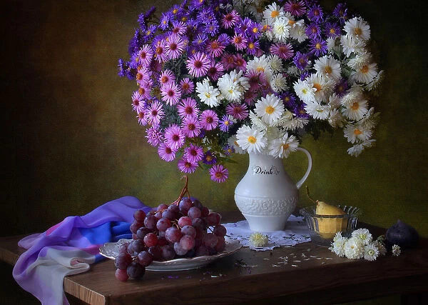 Still life with a bouquet of chrysanthemums and grapes