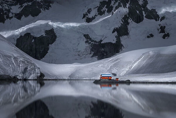 A Red House by Antarctica Glacier