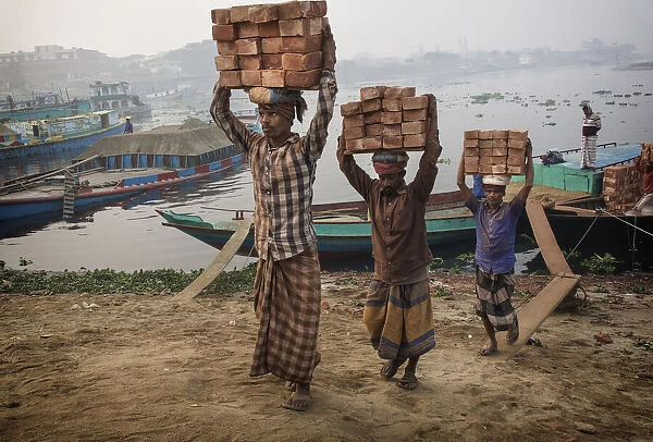 transporting bricks at Biruganga riverbank