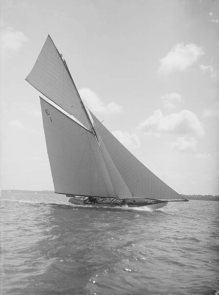 The 12 Metre yacht Alachie makes swift progress upwind, 1911. Creator: Kirk & Sons of Cowes