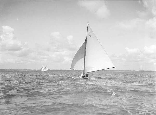 The 6 Metre Cynthia running downwind under spinnaker, 1912. Creator: Kirk & Sons of Cowes