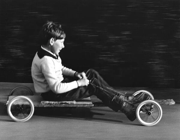 Boy driving a home-made go-kart, Horley, Surrey, 1965