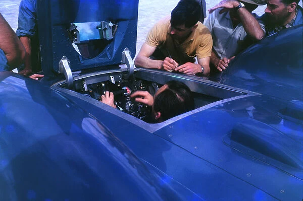 Donald Campbell in Bluebird CN7 cockpit at Lake Eyre 1963, Ken Norris on right. Creator: Unknown