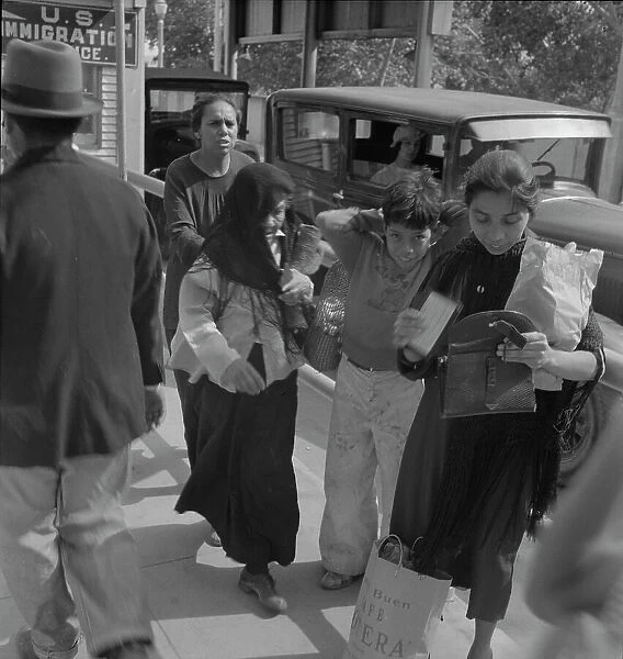 El Paso housewives after a day's shopping in Juarez, Mexico, Texas, 1937. Creator: Dorothea Lange