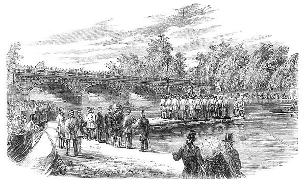 Experiments with Captain Fowke's pontoon bridge on the Serpentine, 1860. Creator: Unknown