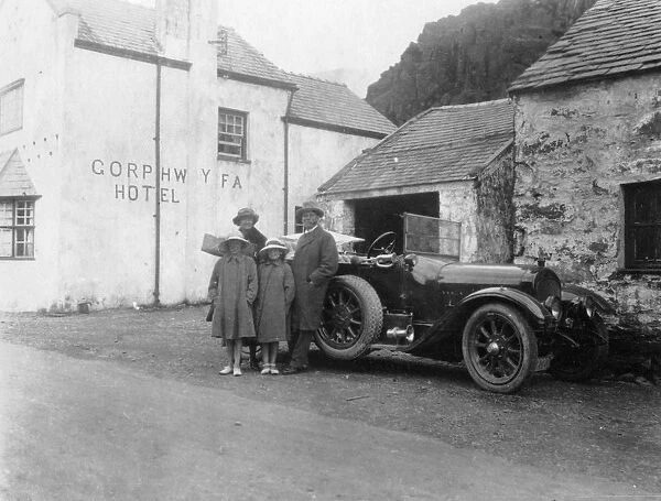A family standing beside their car, Gorphwysfa Hotel, North Wales, c1920s-c1930s(?)
