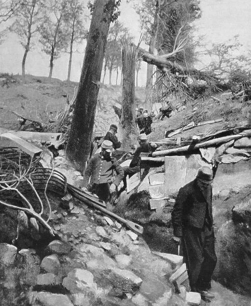 French soldiers going through a trench after a heavy German bombardment, World War I, 1915