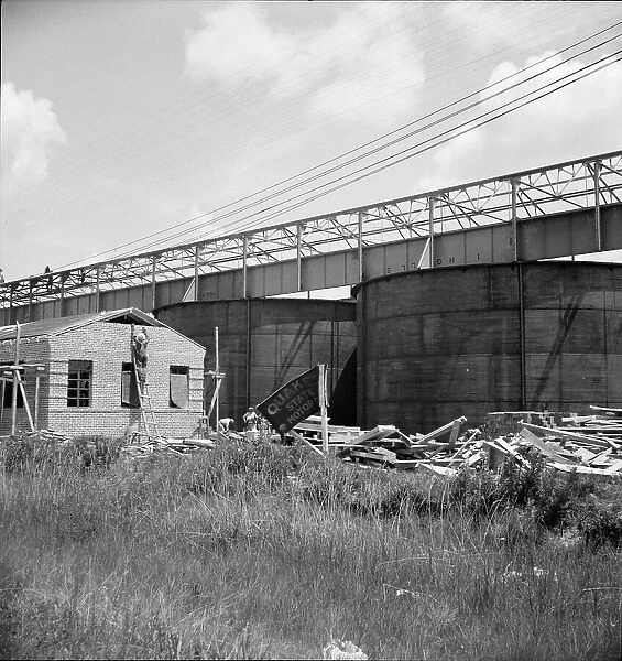 Large turpentine still and processing plant near Valdosta, Georgia, 1937. Creator: Dorothea Lange