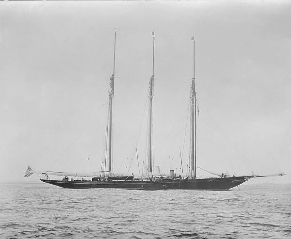 Three masted schooner at anchor. Creator: Kirk & Sons of Cowes
