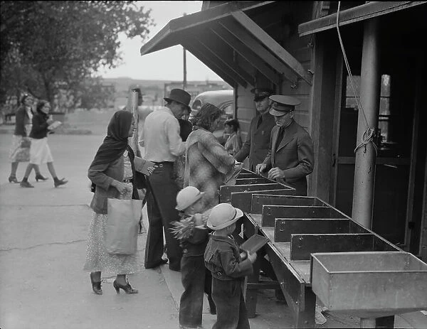 Plant quarantine inspectors examining packages, Texas, 1937. Creator: Dorothea Lange