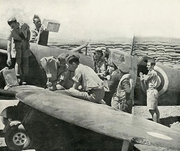 Refuelling and re-arming Spitfire fighters, Malta, World War II, 1942 (1944). Creator: Unknown