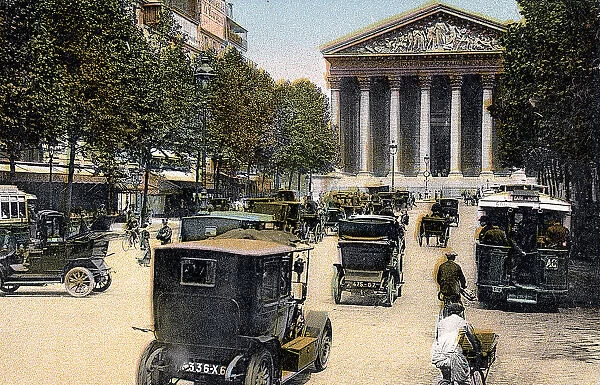 Rue Royale and the Madeleine, Paris, with cars and a motorbus on the street, c1900